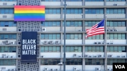 The U.S. Embassy in Seoul displays a Black Lives Matter banner and LGBTQ pride flag, in Seoul, South Korea, June 15, 2020. (William Gallo/VOA)