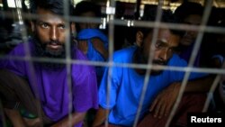 Refugees from Bangladesh, who were rescued by the Myanmar navy, are seen at a Muslim religious school used as a temporary refugee camp, at the Aletankyaw village in the Maungdaw township, in Rakhine state May 23, 2015. The head of Rakhine state from which