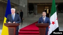 烏克蘭外長安德烈·西比加與敘利亞新任外長阿薩德·哈桑·什巴尼共同召開記者會，說明兩國強化關係的舉措。(路透社：2024年12月30日)