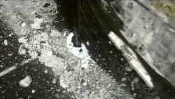 In this photo taken and released on Thursday, July 11, 2019, by the Japan Aerospace Exploration Agency, the Japanese Hayabusa2 spacecraft lands on an asteroid to collect samples. (AP)