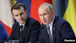 俄羅斯總統普京與法國總統馬克龍。 （路透社2019年12月9日）