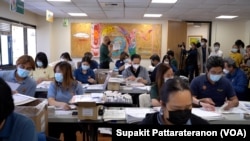 Officers prepare mail ballot packages for the Thailand General Election absentee voting in the US at the Royal Thai Consulate General Los Angeles, CA, April 19, 2023