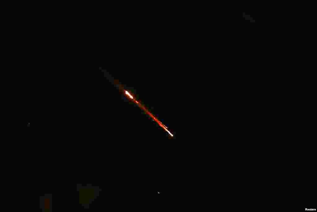 Objects are seen in the sky above Jerusalem after Iran launched drones and missiles towards Israel, in Jerusalem, April 14, 2024.&nbsp;