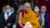 Pemimpin spiritual Tibet Dalai Lama tersenyum saat memimpin upacara peringatan ulang tahunnya yang ke-88 di kuil Tsuglakhang di Dharamshala, India, 6 Juli 2023.