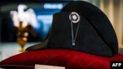 FILE - A black bicorne hat with red, white and blue cockade worn by the French Emperor Napoleon I, from the Collection Jean-Louis Noisiez, is displayed before an auction sale at Osenat auction house in Paris, on Nov. 6, 2023. 