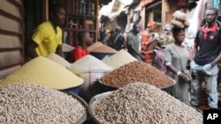 Pedestrians shop for items at the Mile 12 Market in Lagos, Nigeria, Feb. 16, 2024.