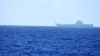 FILE - A helicopter takes off from China's Shandong aircraft carrier over Pacific Ocean waters south of Okinawa prefecture, Japan, in this handout photo taken April 15, 2023, and released by the Joint Staff Office of the Defense Ministry of Japan.