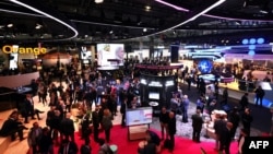 Visitors attend the Mobile World Congress (MWC), the telecom industry's biggest annual gathering, in Barcelona, Feb. 27, 2023. 