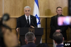 Israel's opposition leader and former premier Yair Lapid speaks during a press conference in Jerusalem on Feb. 13, 2023, against controversial legal reforms being touted by the country's hard-right government.