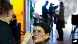 Sparta gets makeup during a photo shoot for the L'Imperfetta model agency in Rome, Tuesday, Feb. 7, 2023.
