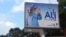 A defaced billboard of Gabon President Ali Bongo Ondimba is seen on an empty street in Libreville, Aug. 30, 2023. Mutinous soldiers said on state television that they had seized power and were overturning the results of the recent presidential election.