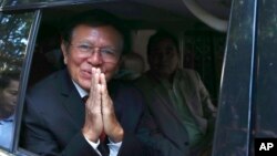 Kem Sokha, a founder of the Cambodia National Rescue Party, offers a greeting from his car in front of his house in Phnom Penh, Cambodia, March 3, 2023. 