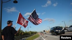 Supporters of former U.S. President Donald Trump gather outside his Mar-a-Lago resort, in Palm Beach, Florida, March 31, 2023.