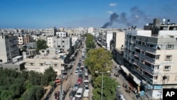 Palestinians flee from northern Gaza to the south after the Israeli army issued an unprecedented evacuation warning to a population of over 1 million people in to seek refuge ahead of a possible Israeli ground invasion, Oct. 13, 2023.