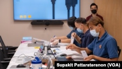 Officers sort received overseas absentee ballots, preparing to pack in diplomatic pouches and send them back to count in Thailand at the Royal Thai Consulate-General of Los Angeles, CA.