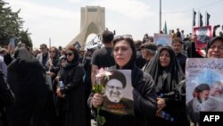 Mourners attend the funeral of Iran's President Ebrahim Raisi at Azadi square in Tehran, Iran, May 22, 2024.