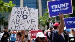 People rally outside the Wilkie D. Ferguson Jr. U.S. Courthouse, June 13, 2023, in Miami.