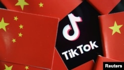 TikTok標識與中國國旗圖示。（路透社照片）