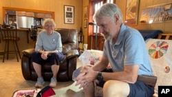 Balloon pilots Peter Cuneo and Barbara Fricke talk Sept. 21, 2023, about their gear during an interview in Albuquerque, N.M.