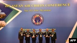Myanmar's Air Force chief Htun Aung (3rd R) poses for photos with his counterparts at the 20th ASEAN Air Chiefs Conference, in Naypyidaw, on September 13, 2023. (Photo by Handout / MYANMAR MILITARY INFORMATION TEAM / AFP)