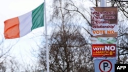 "No" posters are seen in the street outside government buildings in Dublin, Ireland, March 5, 2024, ahead of referendums on the roles of women and family in Irish society.