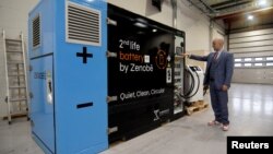 Zenobe's Founder Director Steven Meersman shows off one of the company's second-life battery energy storage units at the startup's innovation centre in Portsmouth, Britain February 20, 2023. (REUTERS/Nick Carey)
