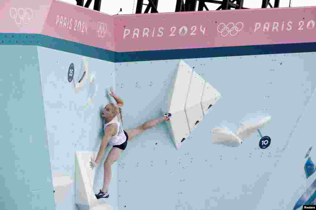 Janja Garnbret of Slovenia competes in the women's boulder and lead, semi-final boulder sport climbing race during the Paris Olympics in Le Bourget, France.