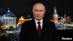 Russian President Vladimir Putin delivers his annual New Year's address to the nation, in Moscow, Russia, in this picture released Dec. 31, 2023. (Sputnik/Gavriil Grigorov/Pool via Reuters)