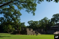 Tourists walk through the Acropolis of Copan, an ancient Maya site in western Honduras, Sunday, Sept. 24, 2023. (AP Photo/Moises Castillo)