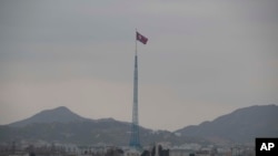 FILE - A North Korean flag flutters in Gijungdong, as seen from a South Korean observation post inside the demilitarized zone in Paju, South Korea, during a media tour, March 3, 2023. The United States wants China to do more to monitor North Korean sanctions violations. 