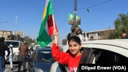 Hilbijartinên Parêzgehên Îraqê, 18 Kanûna Pêşîn 2023, zarokek tevî alayê Kurdan li bajarê Kerkuk