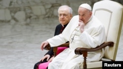 FILE - Pope Francis attends the weekly general audience in Paul VI hall at the Vatican, March 27, 2024. 