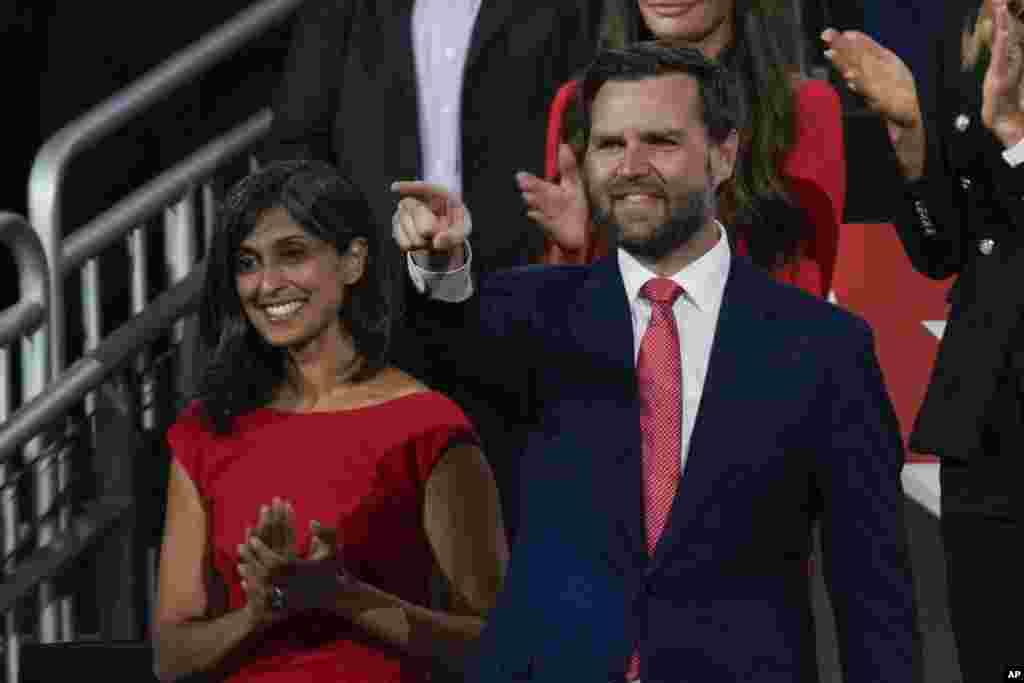 Republican vice presidential candidate Sen. J.D. Vance, R-Ohio, gestures to Republican presidential candidate former President Donald Trump during the Republican National Convention, July 18, 2024, in Milwaukee.