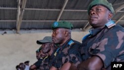 Wanajeshi wa jeshi la Congo wanaotuhumiwa kwa kosa la uasi na woga wakati wakipambana na waasi wa M23 wakiwa kizimbani Goma, Mei 03, 2024. Picha na MURHABAZI/AFP