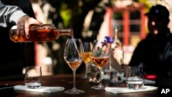 A waiter pours wine during a tasting at Kullabergs Vingård, in Nyhamnsläge, Sweden, July 25, 2023. 
