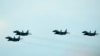 Jet MiG-29s milik Angkatan Udara Slowakia terbang dalam sebuah acara di Malacky, Slowakia, pada 27 Agustus 2022. Slowakia telah mengirim 13 jet tempur MiG-29 kepada Ukraina sebagai bantuan perang. (Foto: AP/Petr David Josek)