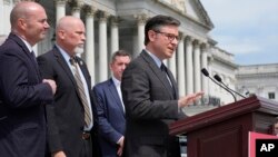FILE - Speaker of the House Mike Johnson, R-La., talks to reporters about requiring American citizenship to vote in national elections, at the Capitol in Washington, May 8, 2024.