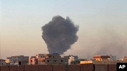 In this photo provided by Maheen S , smoke fills the sky in Khartoum, Sudan, near Doha International Hospital on April 21, 2023.