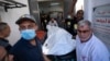 Members of the World Central Kitchen aid group transport the body of one of the six foreign aid workers who were killed in an Israeli strike, at a hospital morgue in Rafah, April 3, 2024.