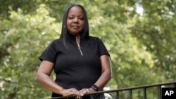 Philadelphia school district teacher Rhonda Hicks poses for a portrait at her home in Philadelphia, Thursday, July 20, 2023. (AP Photo/Michael Perez)