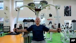 Shigeo Takahashi, 83, uses a weight machine as he works out at the Fukagawa Sports Center in Tokyo, June 12, 2024. Experts say that as we age, weight-resistance training might deliver unexpected benefits. (AP Photo/Hiro Komae)