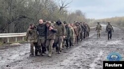 Ukrainian prisoners of war are seen during a swap, amid Russia's attack on Ukraine, at an unknown location, Ukraine, in this screengrab from a video released Apr. 16, 2023. (Coordination Headquarters for the Treatment of Prisoners of War via Reuters)