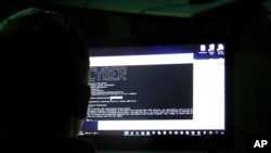 FILE - Indians were lured into employment in Cambodia forced to participate in cyber fraud schemes.