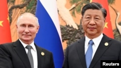 Ruski predsednik Vladimir Putin i predsednik Kine Ši Đinping tokom sastanka na marginama Foruma o Inicijativi "Pojas i put", u Pekingu, 18. oktobra 2023.
