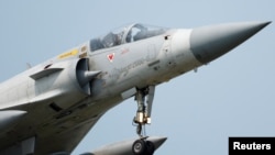 FILE - A Taiwan Air Force Mirage 2000-5 aircraft prepares to land at Hsinchu Air Base in Hsinchu, Taiwan, April 11, 2023.