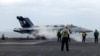 Sebuah jet tempur F-18E bersiap lepas landas dari kapal induk USS Theodore Roosevelt, Kamis 11 April 2024, selama latihan angkatan laut gabungan selama tiga hari oleh AS, Jepang, dan Korea Selatan di Laut Cina Timur. (AP/Mari Yamaguchi)