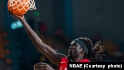Al Ahly player Anunwa Omotaki puts the ball in the net against Capetown Tigers in the BAL league. (Photo by NBAE/Getty Images).
