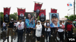 Empleados públicos participan en una manifestación de apoyo a Daniel Ortega