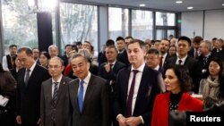 Belgium's Prime Minister Alexander De Croo, Foreign Minister Hadja Lahbib and Chinese Foreign Minister Wang Yi attend an event marking the inauguration of the new Belgian embassy in Beijing, China, Jan. 11, 2024. 