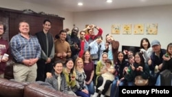 Sarah Mannix and her students from the English Language Center at Old Dominion University celebrate Thanksgiving at her house. (Photo courtesy of Sarah Mannix)